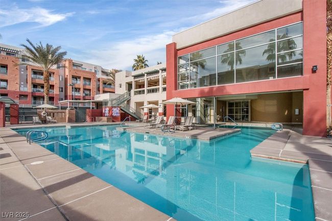 Community pool with a patio and fence | Image 25