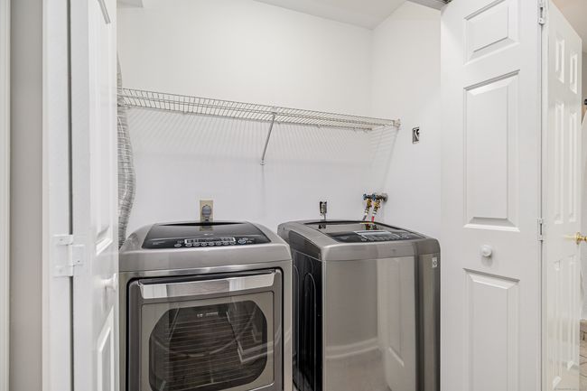 Laundry conveniently located in the hallway closet. | Image 10
