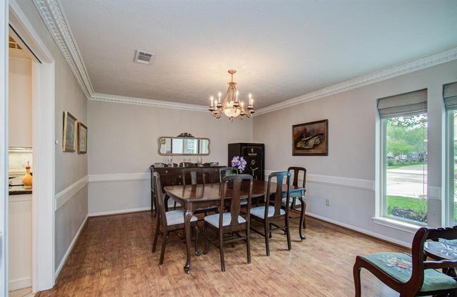 The 15x13 dining room accomodates large scale entertaining with style and ease. | Image 5