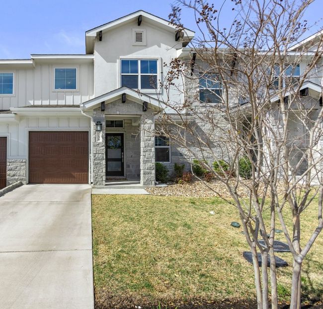 . With its mix of stone and board-and-batten exterior, the home’s curb appeal is both timeless and contemporary. | Image 5
