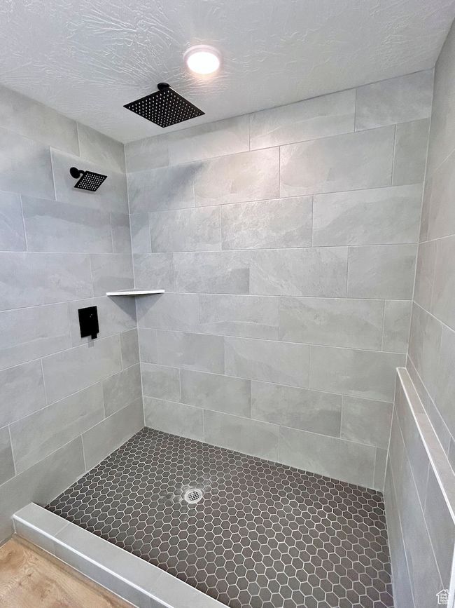 Full bathroom featuring tiled shower | Image 21
