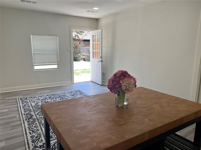 View of the living room, island with nice laminate floor from door to the guest house | Image 36