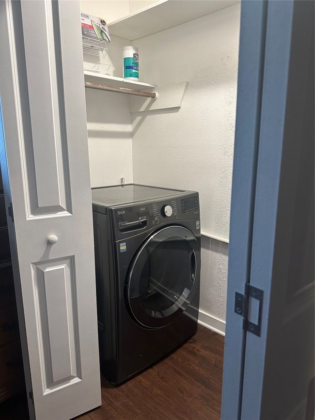Washroom with washer / dryer and wood finished floors | Image 22