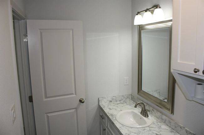 Bathroom featuring vanity | Image 6