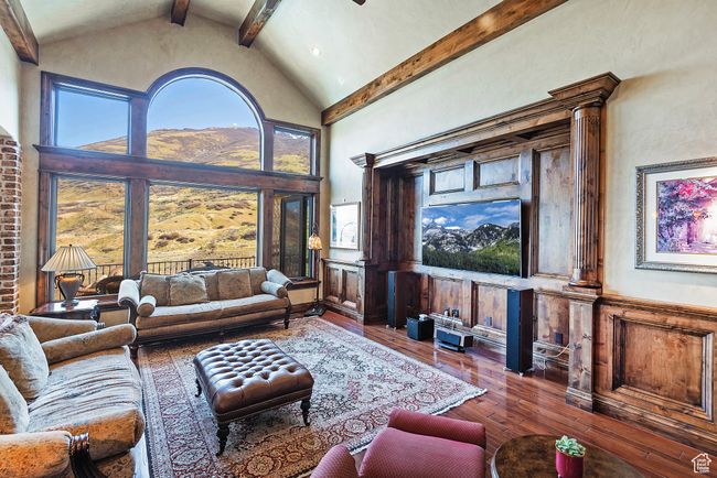 Living room with beamed ceiling, high vaulted ceiling, and wood-type flooring | Image 15