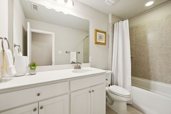 Full bath featuring vanity and shower / tub combo with curtain | Image 18
