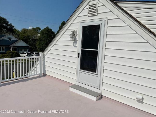 Very large balcony off master bedroom with view of lake | Image 29