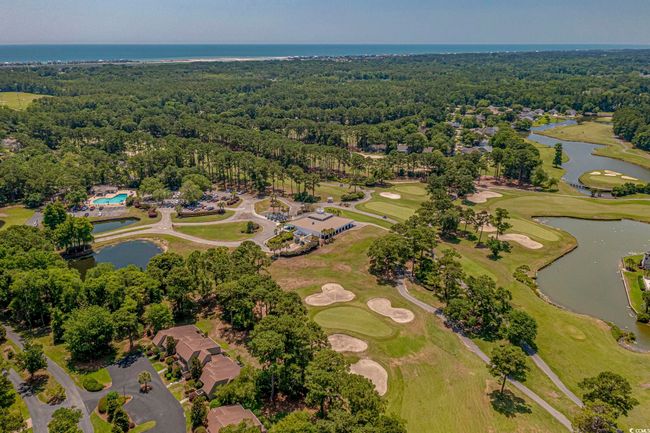Aerial overview of property's location featuring a large body of water and a heavily wooded area | Image 34