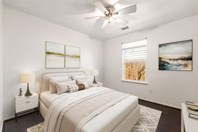 Wood style flooring, soft natural light, and a peaceful atmosphere make this secondary bedroom a great retreat for relaxation or productivity. *Virtually Staged | Image 7