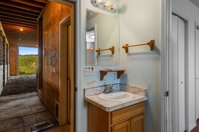 Bathroom and entrance to barn from living quarters | Image 70