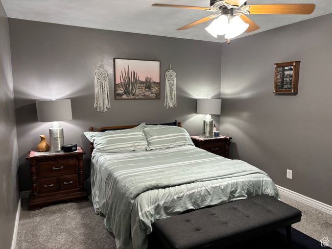 Carpeted bedroom with baseboards and a ceiling fan | Image 4