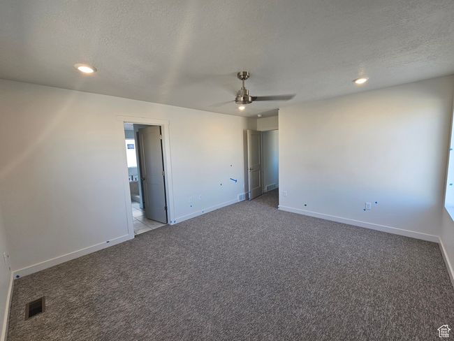 Unfurnished room featuring ceiling fan, carpet, a textured ceiling, and recessed lighting | Image 17
