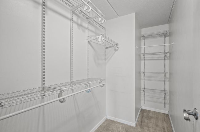 Primary bedroom walk-in closet | Image 18