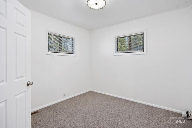 Unfurnished room with carpet floors and healthy amount of natural light | Image 23