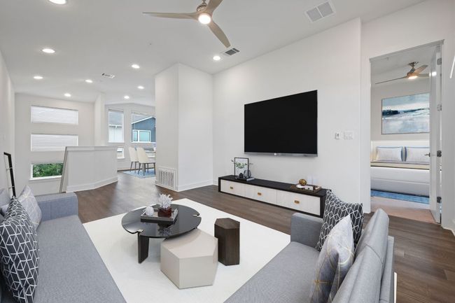 Digital staging at Living area featuring a ceiling fan, wood finished floors, and recessed lighting | Image 8