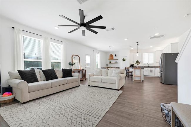 Bright and airy living space with abundant natural light and open-concept layout. | Image 6