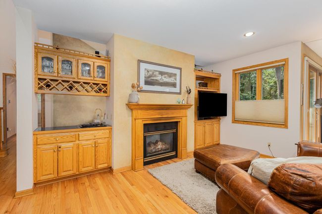 Double Sided Fireplace into Kitchen-Porch 9316 Yukon Ave S | Image 9
