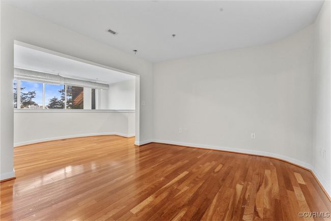 Empty room featuring baseboards, wood finished floors, and visible vents | Image 28
