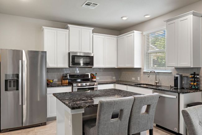 Kitchen w/ White Shaker Cabinets, Granite Counter Top & SS Appliances | Image 7