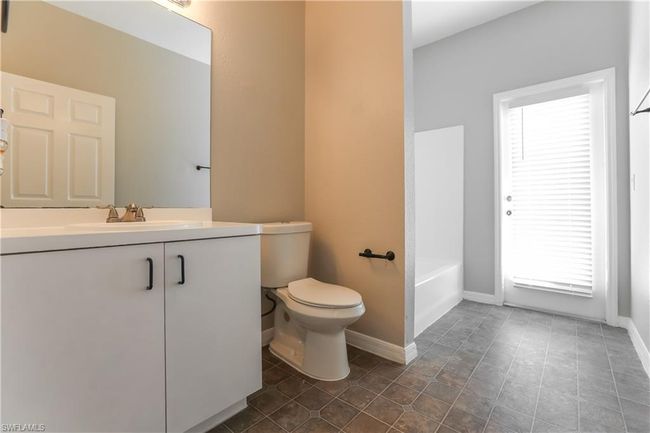 Bathroom with vanity and tile patterned flooring | Image 7