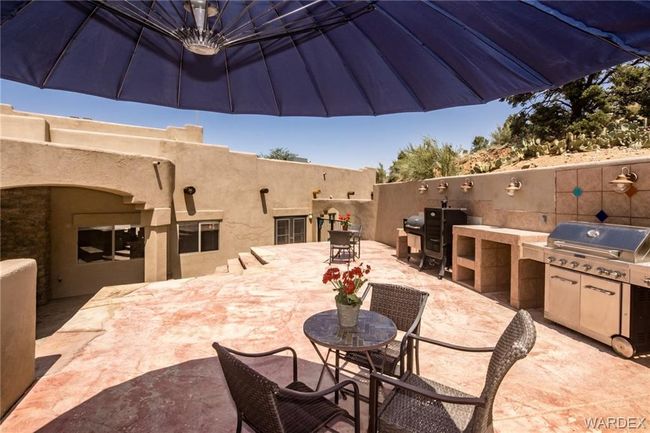 View of patio featuring an outdoor kitchen and outdoor dining area | Image 14