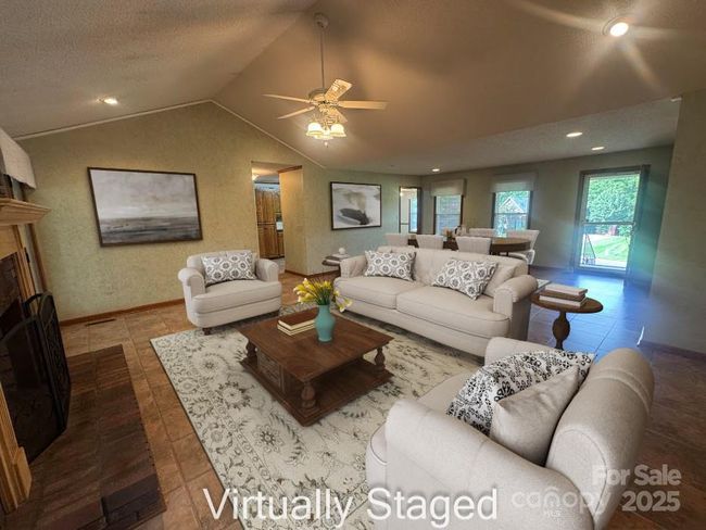 virtually staged view from fireplace of living area | Image 13
