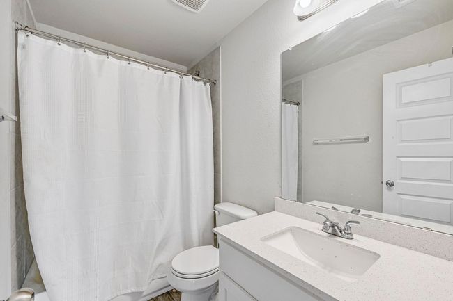 Second full bathroom upstairs with quartz counters and tub/shower combination. | Image 20