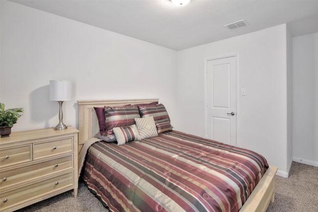 Bedroom featuring carpet floors and baseboards | Image 19