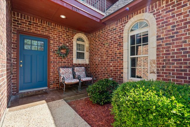 Doorway to property featuring brick siding | Image 4