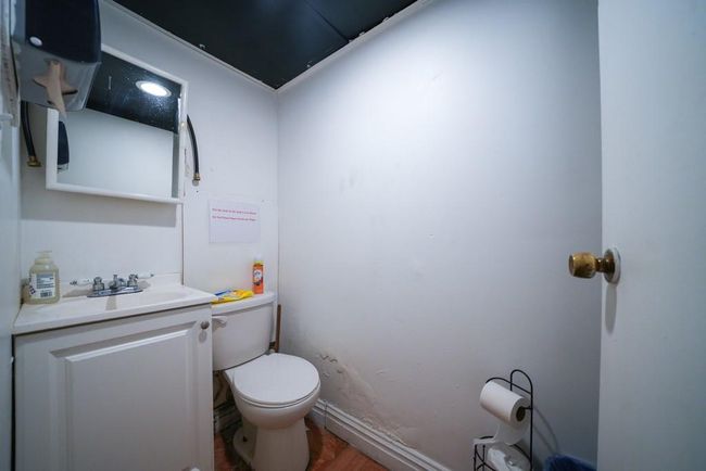 Bathroom with toilet and vanity | Image 7