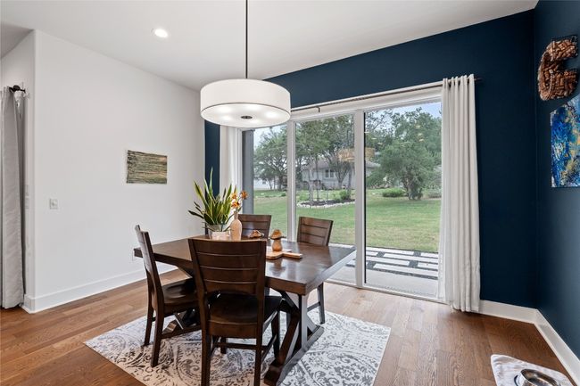 Dining space featuring light wood-style flooring, baseboards, and recessed lighting | Image 10