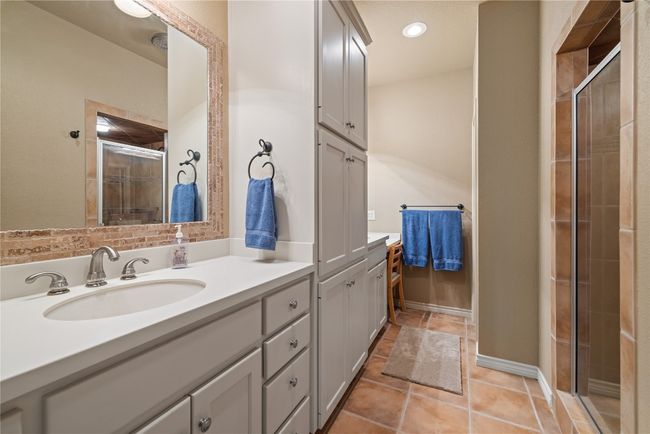 Bathroom featuring tile patterned flooring, a shower stall, vanity, and recessed lighting | Image 18