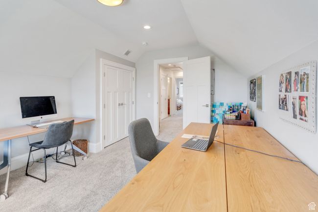 Carpeted office featuring vaulted ceiling | Image 45