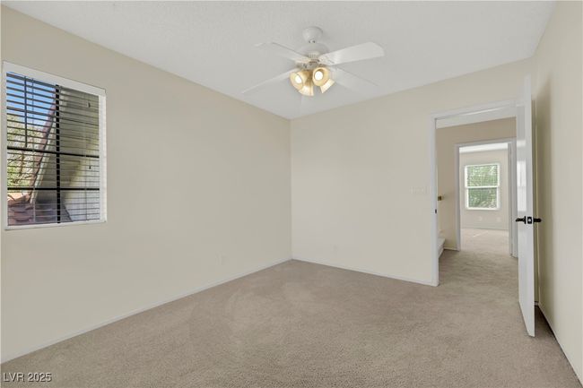 Spare room featuring ceiling fan and light colored carpet | Image 29