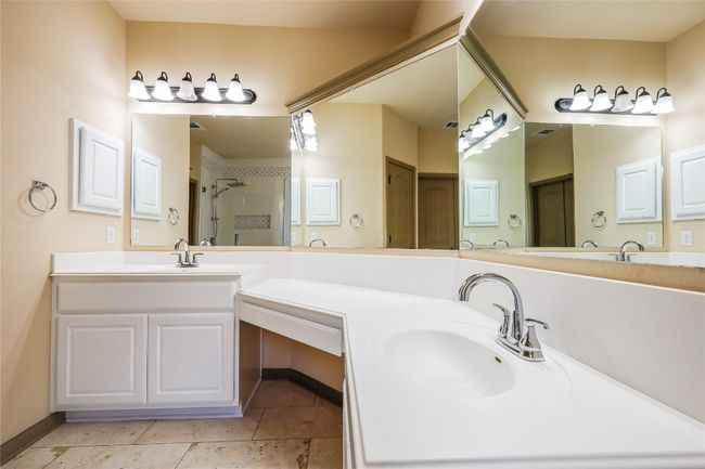 Full bathroom with vanity, a shower stall, and tile patterned floors | Image 39