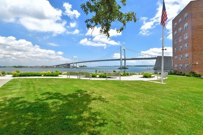 Surrounding community with a lawn and a water view | Image 33