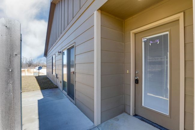 Doorway to property with a patio | Image 4