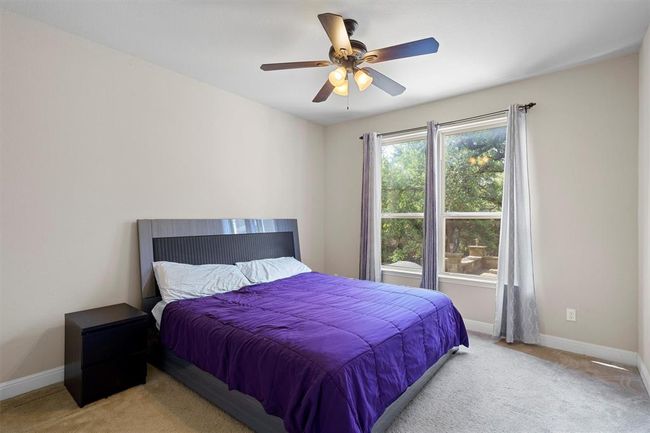 Carpeted bedroom with baseboards and ceiling fan | Image 15
