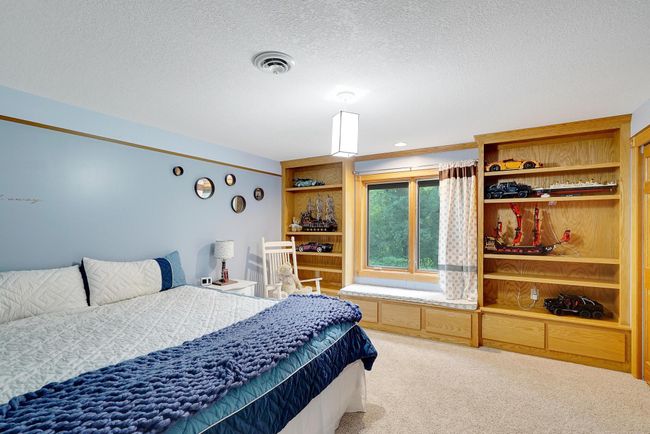 What a dreamy spot to read a book! As with the rest of this beautiful home, tons of additional storage. | Image 32