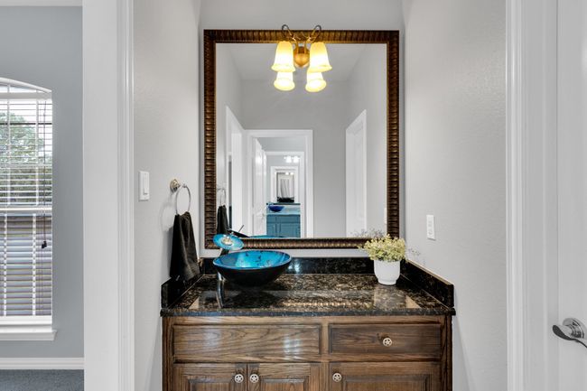 Bath featuring custom sink and vanity | Image 23