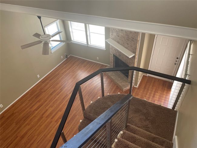 Stairway featuring ceiling fan and hardwood / wood-style floors | Image 11