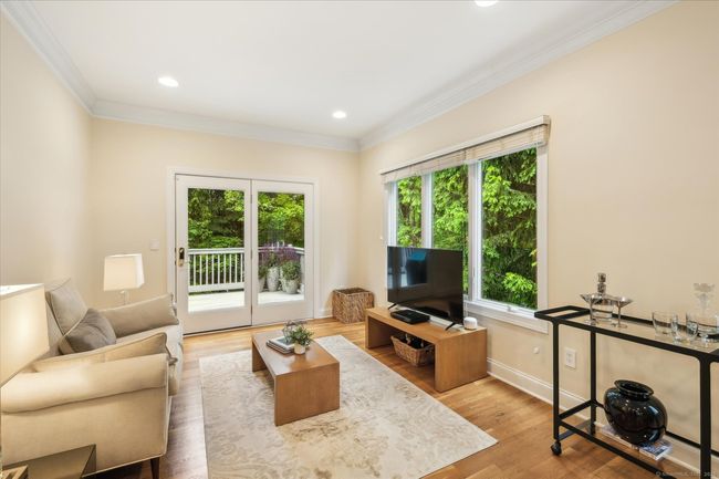 Family room with doors leading to the deck. | Image 10