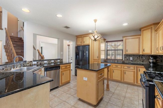 Kitchen island also boasts additional storage. | Image 17