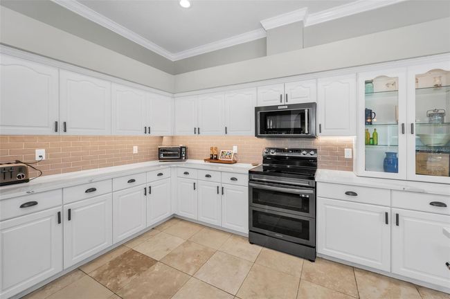 Chef's kitchen loaded with cabinets storage | Image 10