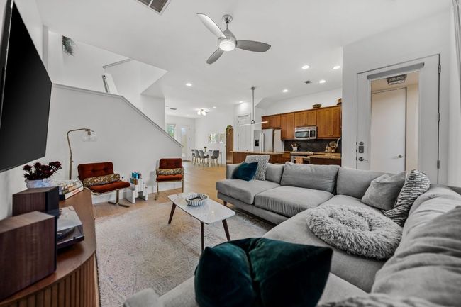 Living room featuring ceiling fan, light wood-style floors, visible vents, and recessed lighting | Image 12