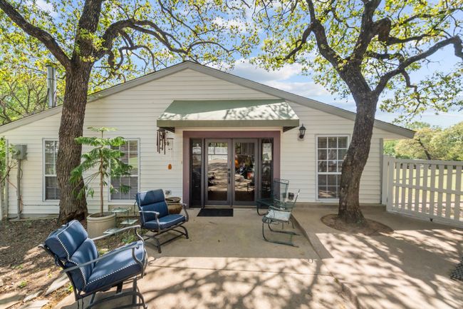 Rear view of property featuring french doors, fence, and a patio area | Image 31