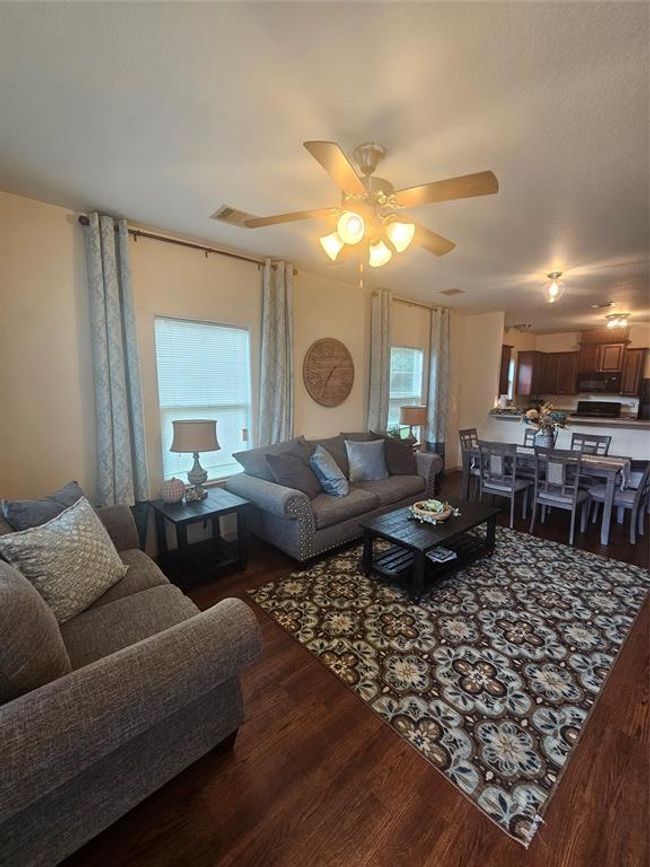 Family/dining room looking into kitchen. Showing the breakfast bar which can seat four. | Image 5
