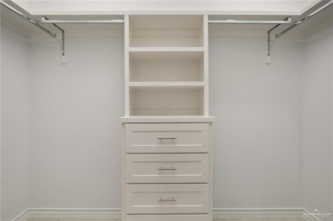 View of spacious closet | Image 12