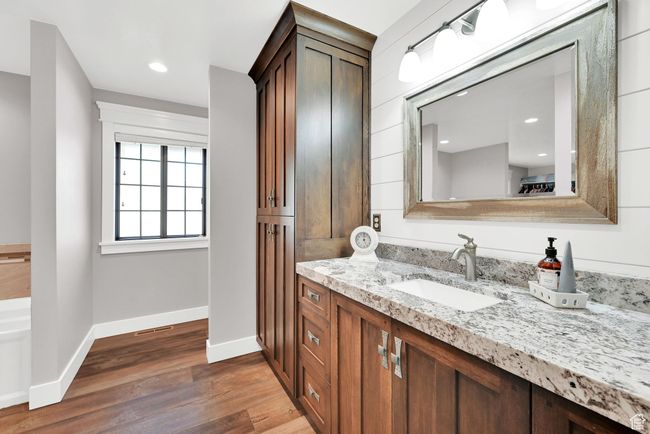 Bathroom featuring wood-type flooring and vanity | Image 21