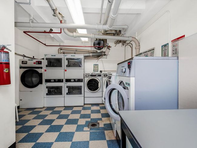 Shared laundry with washer and dryer, stacked washer / dryer, and tile patterned floors | Image 10